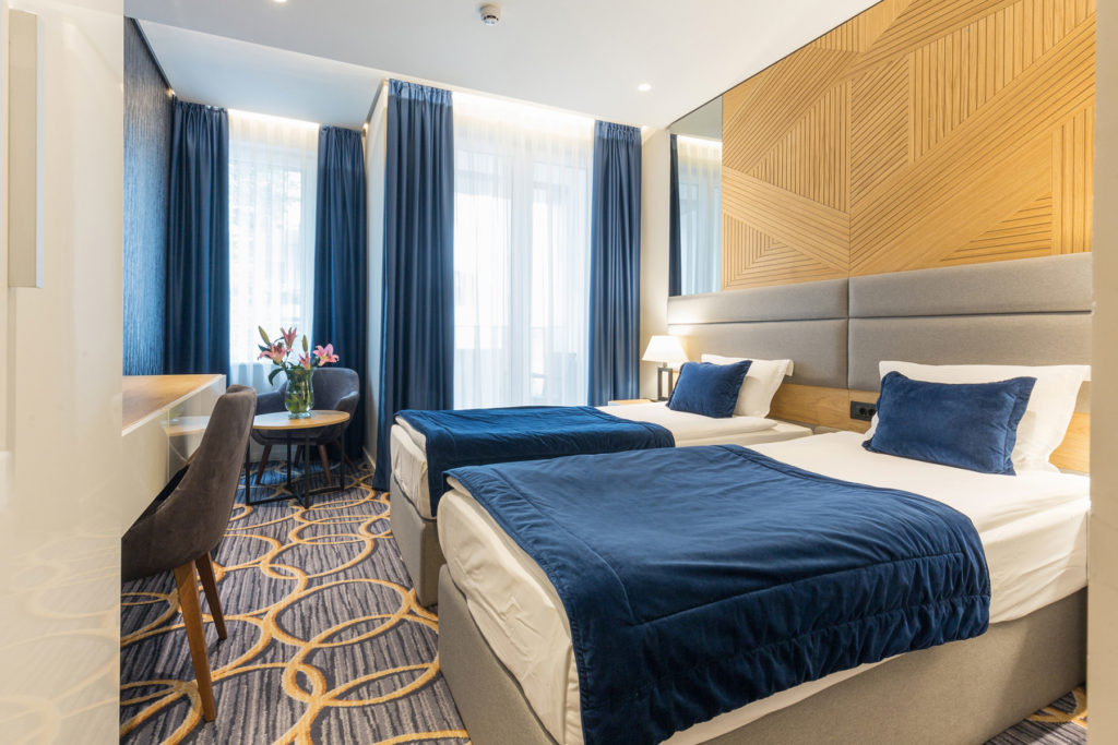 Interior of a modern luxury hotel double bed bedroom