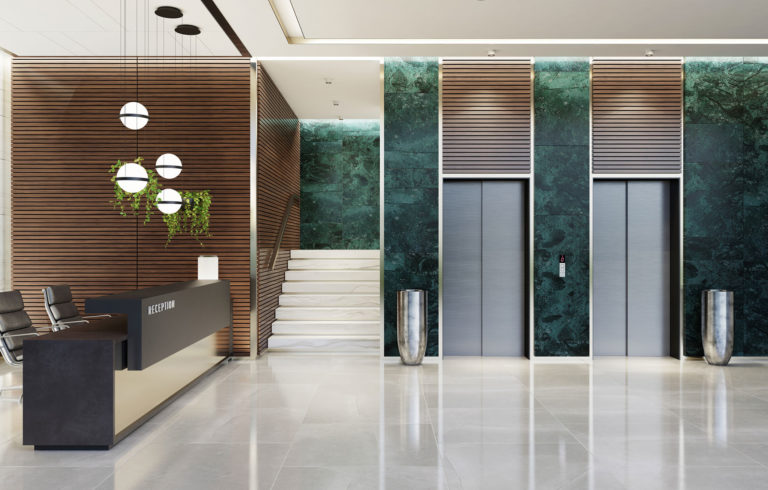Modern Offices lobby interior area with elevators and stairs and with long reception desk