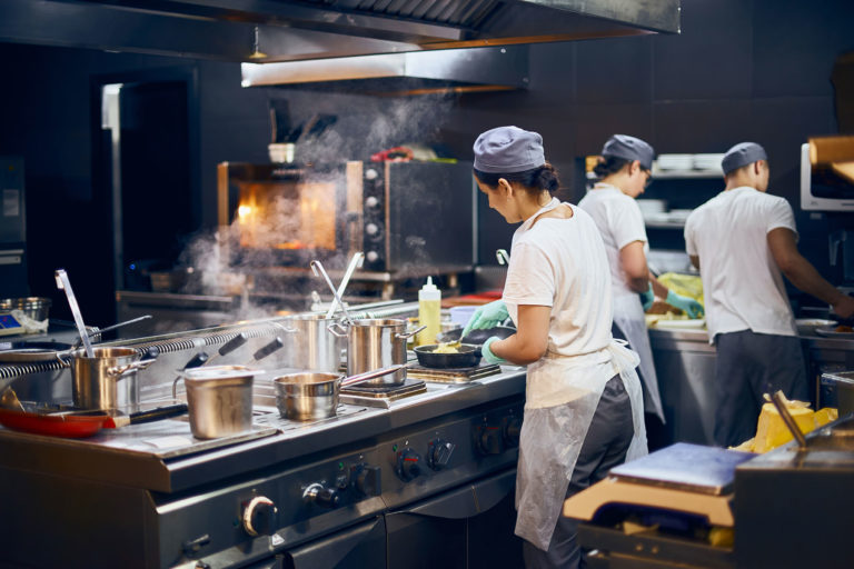 Chefs work in a modern kitchen