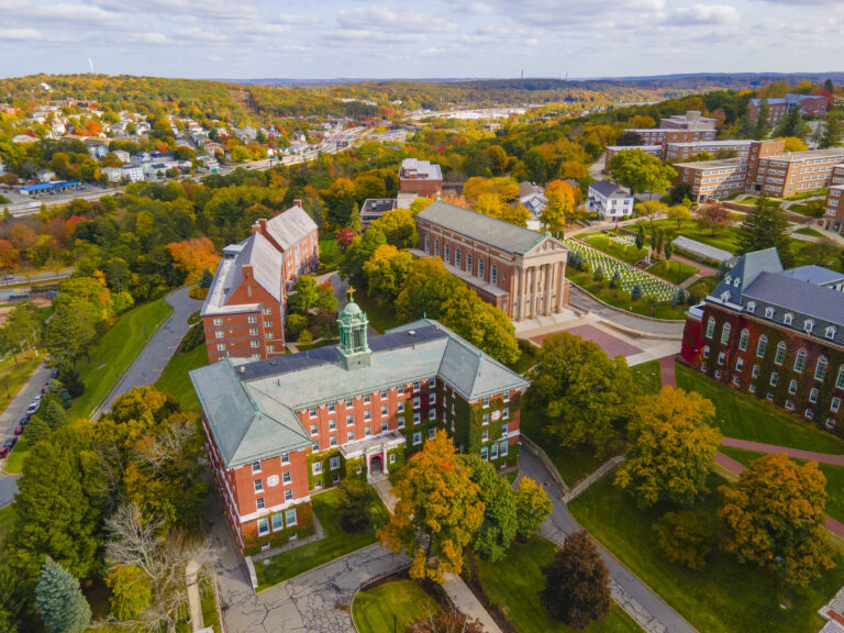 College of the Holy Cross and landscape aerial view with fall foliage, City of Worcester, Massachusetts MA, USA.